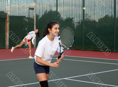 Girls playing tennis