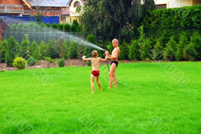 boys play on the grass