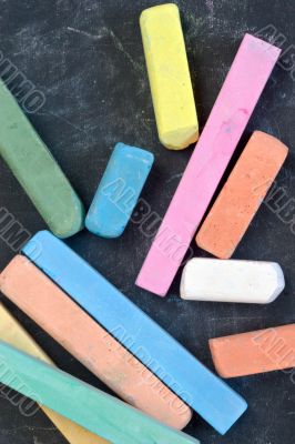 blackboard with coloured crayons