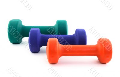 Three dumbbells of different colors