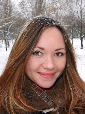 Portrait of the beautiful girl in the winter