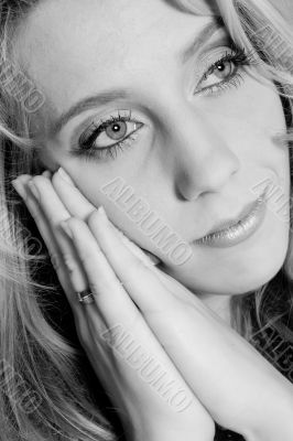Studio portrait of a long blond girl in rest
