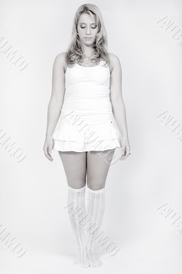 Studio portrait of a long blond girl standing