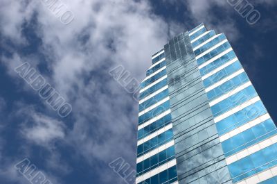 Blue skyscraper in blue sky