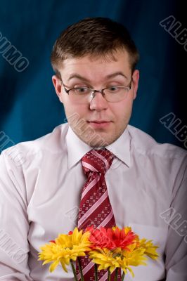 Shocked man with flowers