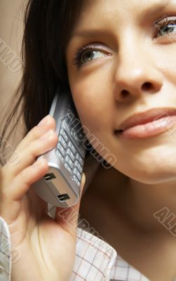 Smiling attractive woman with a phone
