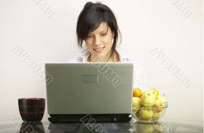 beautiful woman with laptop chair over white