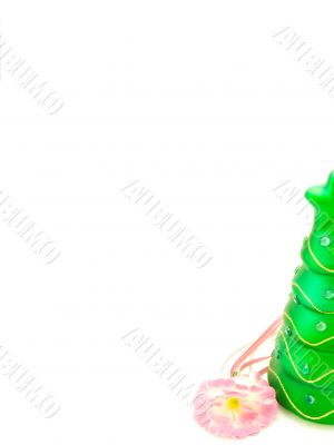 new-year candle in form the decorated fir-tree on a white backgr