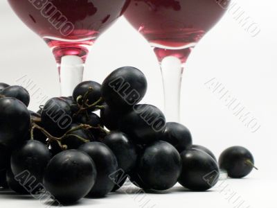 Red wine and grapes