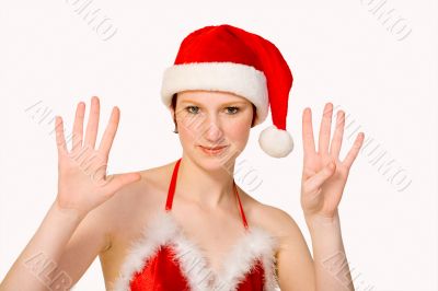 Studio portrait of a Christmas faerie counting 9