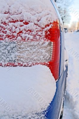 Car bumper covered by snow