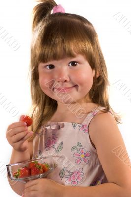 Little girl with strawberries