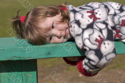 Girl lying on bench