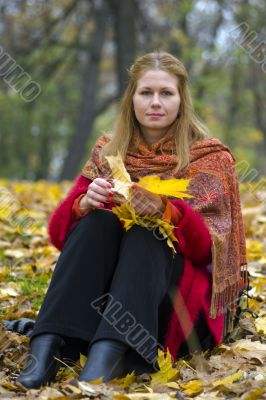 Woman with maple leaves