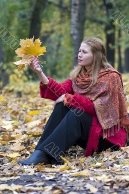 Beautiful woman in the autumn park