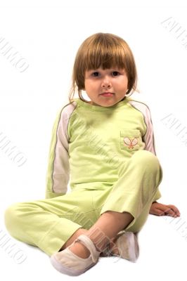 Little girl sitting on the floor