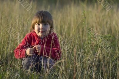 Calm little girl in fall sunset
