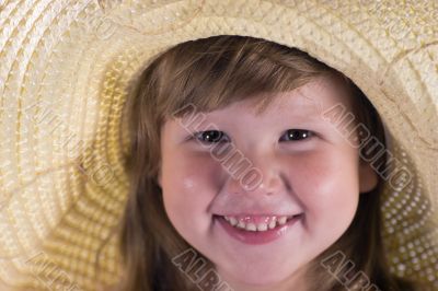 Happy laughing girl in straw