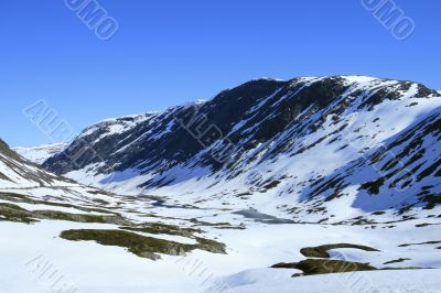 Snow mountains in summer day.