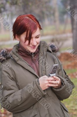 Teen checking her mobile phone