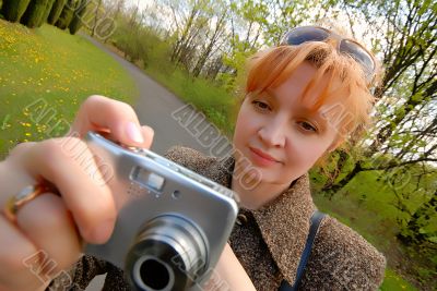 woman with  camera in park
