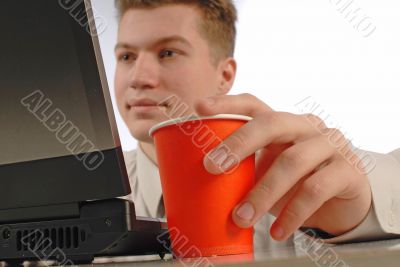 young businessman works on  laptop