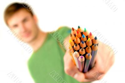 color pencils in hand, close up