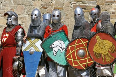 several knights on stone wall background