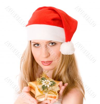Winter portrait of a beautiful smiling woman with a gift