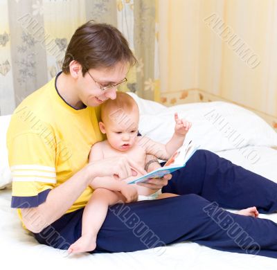 Father reading to his son