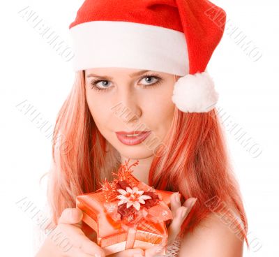Winter portrait of a beautiful smiling woman with a gift