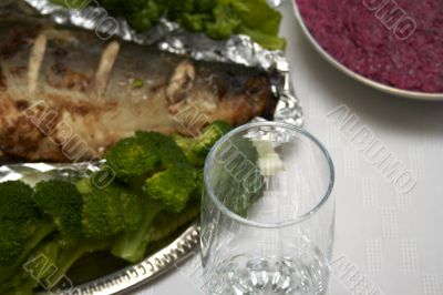 Close-up of baked pink salmon served with broccoli