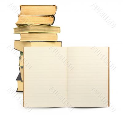 lined exercise book with books in background