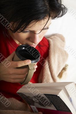 young beautiful woman is reading a book