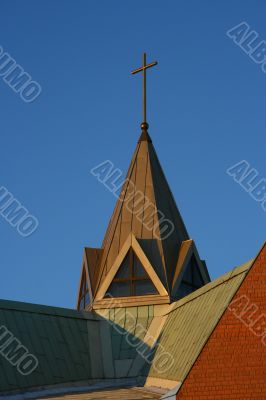 The top part and cross of Catholic church.