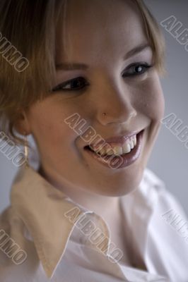 Portrait of a smiling blond curly woman
