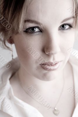 Portrait of a hypnotizing blond curly woman