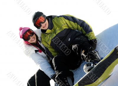 Couple of happy snowboarders