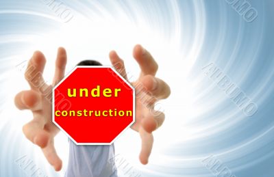 Man grabing a red sign.