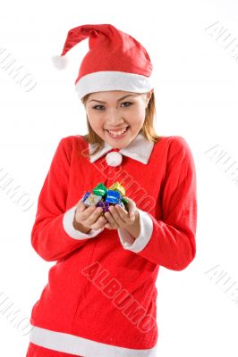 cute santa with tiny gifts joyfully