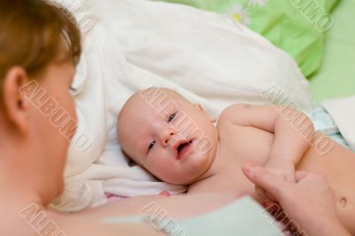 Mother and baby relaxing in the bed