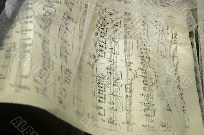 music noted through white gauze