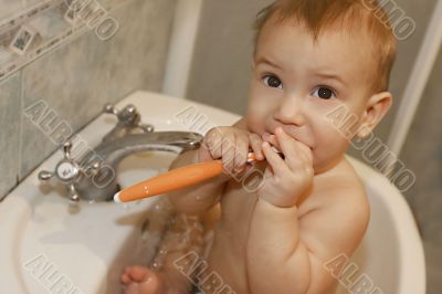 baby cleaning his teeth