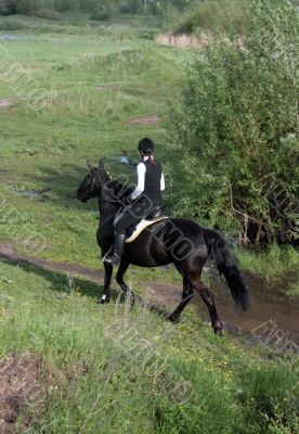 The girl on a horse.