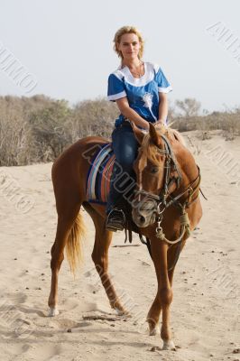 Girl riding on the beach