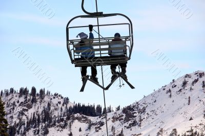 Skiers on chairlift