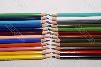 Set of color pencils on a white background