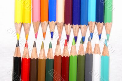 Set of color pencils on a white background