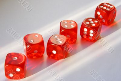 Six playing cubes.