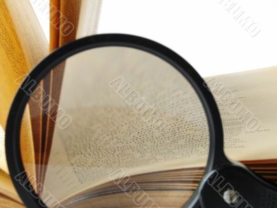 book with magnifying glass